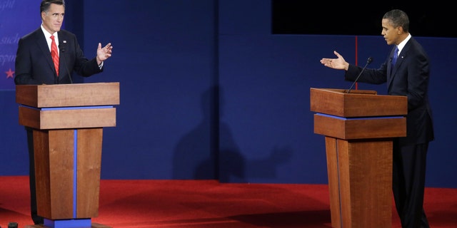 Oct. 3- Republican presidential candidate, former Massachusetts Gov. Mitt Romney, left, and President Barack Obama, right, debate at the University of Denver.