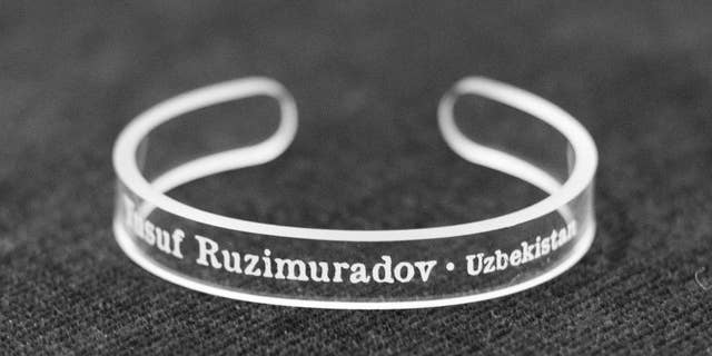This handout photo provided by the Press Uncuffed Campaign shows a bracelet that University of Maryland journalism students are selling emblazoned with the names of journalists imprisoned around the world, to raise money for the cause, and awareness of their plight. The line includes 11 different bracelets, each with the name of a jailed journalist on it. The students are raising money to produce at least 10,000 bracelets. (AP Photo/Press Uncuffed Campaign)
