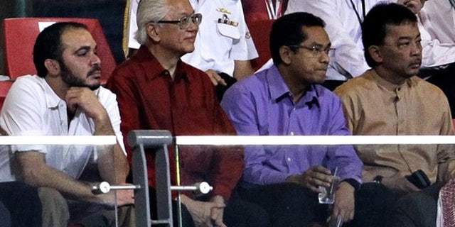 Oct. 11, 2011: Prince Ali Bin al Hussein of Jordan (L) watches as Jordan plays Singapore in their 2014 FIFA World Cup qualifying soccer match in Singapore with Singapore's President Tony Tan and Malaysia's Tengku Abdullah Sultan Ahmad Shah.