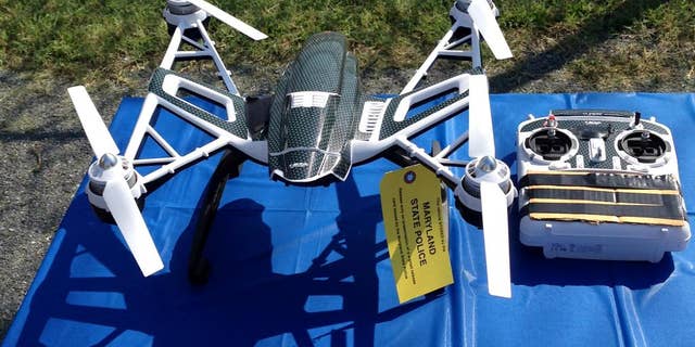 This photo shows a Yuneec Typhoon drone and controller Monday, Aug. 24, 2015, in Jessup, Md. Maryland State Police and prison officials say two men planned to use the drone to smuggle drugs, tobacco and pornography videos into the maximum-security Western Correctional Institution near Cumberland, Md. Police arrested the men with the drone, the materials and a handgun in a vehicle Saturday, Aug. 22, 2015. (AP Photo/David Dishneau)