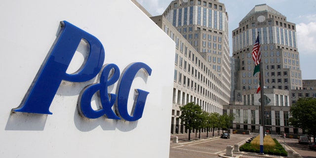FILE - This Aug. 2, 2010, file photo, shows the Procter & Gamble Co. headquarters building in Cincinnati. Procter & Gamble took a hit from the strong dollar, like almost all U.S. companies with business overseas, pushing third-quarter revenue below expectations, the company reported Thursday, April 23, 2015. (AP Photo/Al Behrman, File)