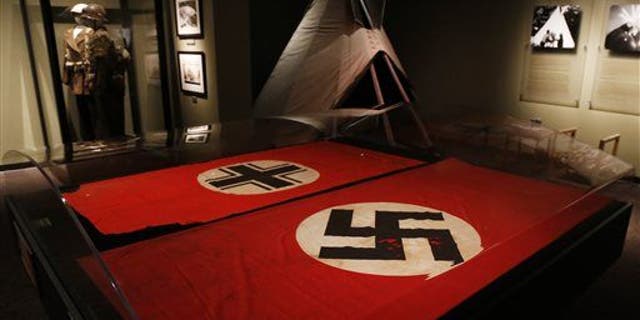 A Nazi German flag with the swastika.