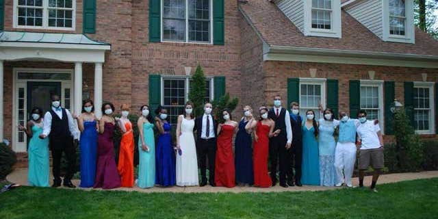 Jared Hill and his friends on prom night, wearing protective masks. (Image courtesy of My Fox Atlanta.)