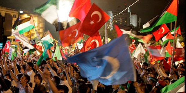 June 2, 2010: Demonstrators chant slogans waving Palestinian and Turkish flags during a protest against Israel, in Istanbul, Turkey.
