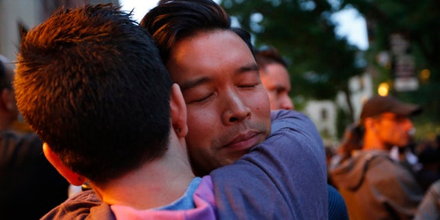 A vigil for victims of the Orlando nightclub shootings at the Stonewall Inn, a gay bar, Monday, June 13, 2016, in New York.