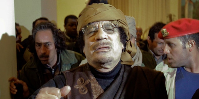 March 8: Libyan Leader Muammar Qaddafi arrives at a hotel to give television interviews in Tripoli, Libya.