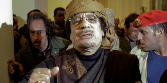 March 8: Libyan Leader Muammar Qaddafi arrives at a hotel to give television interviews in Tripoli, Libya.