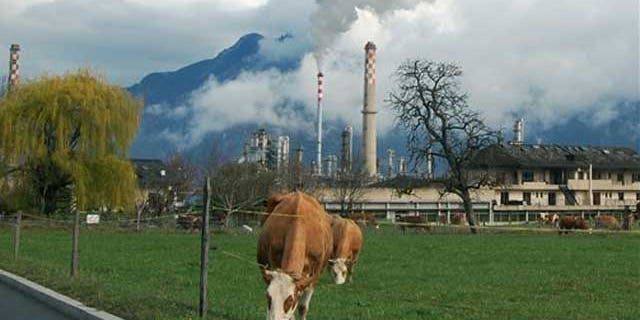 Smoke rises from the Libyan-owned Tamoil oil refinery in Collombey-Muraz, on Wednesday, March 30, 2011, on the eastern tip of Lake Geneva, Switzerland. The refinery is evidence of Libyan leader Moammar Gadhafi's strong foothold in Europe, as Tamoil has been allowed to continue operating unchecked despite the fact that its parent company is on a United Nations sanctions list and some experts including Zurich-based money-laundering expert Michael Alkalay, say European governments are being naive, or simply self-serving, in an attempt to protect European jobs and oil supplies.