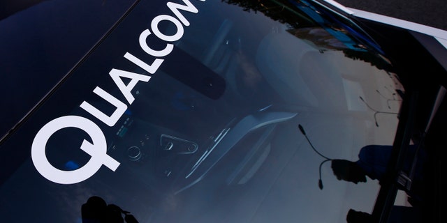 A logo of U.S. chipmaker Qualcomm is seen on the windshield of a car in Beijing September 13, 2014. China's National Development and Reform Commission (NDRC) has investigated dozens of foreign firms over alleged "anti-competitive behaviour" - from auto parts makers and milk powder producers to drugs firms and tech companies, including Qualcomm Inc, which faces a potential record fine of more than $1 billion. From interviews with more than two dozen attorneys, executives, and experts, who have been drawn into investigations with the NDRC's price supervision and anti-monopoly bureau, a picture emerges of a culture of intimidation. The agency's aggressive tactics coincide with an increasingly sobering business climate for foreign firms in China. Fears over the ruling Communist Party's support for domestic firms has prompted some to declare the end of a golden age for foreign business in the world's second-largest economy. To match Insight CHINA-ANTITRUST/NDRC Picture taken September 13, 2014. REUTERS/Petar Kujundzic (CHINA - Tags: POLITICS BUSINESS LOGO CRIME LAW) - RTR46CHJ