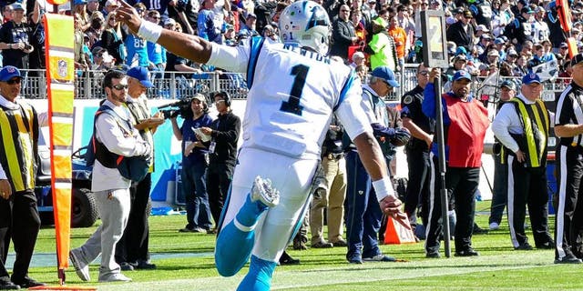 NASHVILLE, TN - NOVEMBER 15: Quarterback Cam Newton #1 of the Carolina Panthers celebrates after a touchdown against of the Tennessee Titans at Nissan Stadium on November 15, 2015 in Nashville, Tennessee. (Photo by Frederick Breedon/Getty Images)