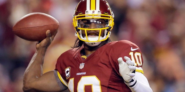 Jan. 6, 2013: In this file photo, Washington Redskins quarterback Robert Griffin III passes the ball during the second half of an NFL wild card playoff football game against the Seattle Seahawks in Landover, Md.