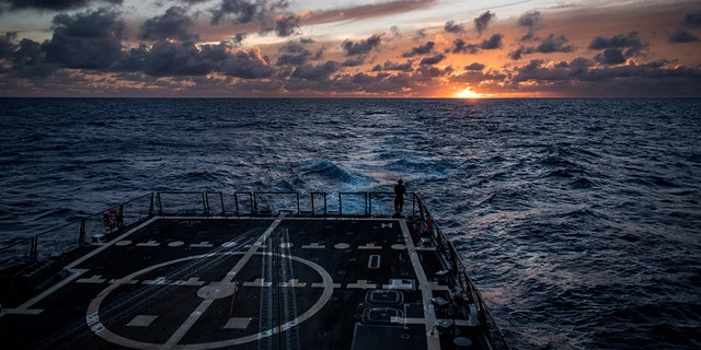 The guided-missile destroyer USS Dewey (DDG 105) transits the Pacific Ocean while participating in the 2018 Rim of the Pacific (RIMPAC) exercise.
