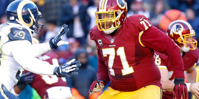 Dec 7, 2014; Landover, MD, USA; Washington Redskins tackle Trent Williams (71) blocks against the St. Louis Rams at FedEx Field. Mandatory Credit: Geoff Burke-USA TODAY Sports