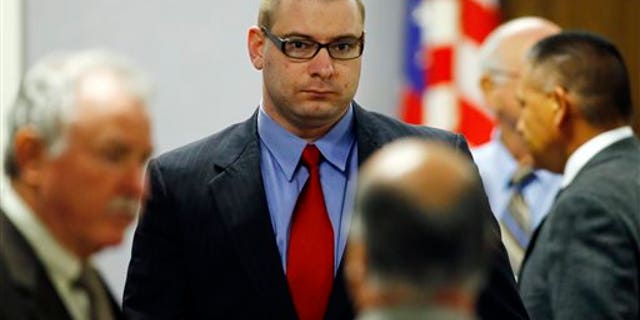Eddie Ray Routh enters the courtroom following a break in his capital murder trial at the Erath County, Donald R. Jones Justice Center in Stephenville, Texas, Tuesday, Feb. 17, 2015. Routh, of Lancaster, is charged with the 2013 deaths of former Navy SEAL Chris Kyle and his friend Chad Littlefield at a shooting range near Glen Rose, Texas. (AP Photo/Mike Stone, Pool)