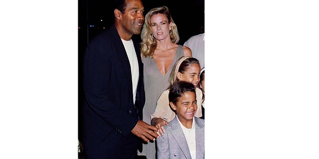 O. J. Simpson is shown with his ex-wife Nicole Simpson and their children, daughter Sidney Brooke, 9, and son Justin, 6, at the March 16, 1994, premiere of Simpson's new film, "Naked Gun 33 1/3: The Final Insult," in Los Angeles.