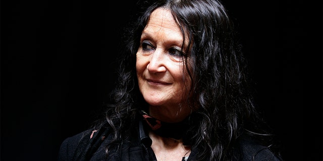 Julia Baird, half sister of former Beatle John Lennon, stands outside the Cavern Club in Liverpool, northern England.