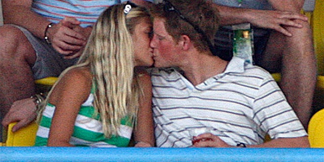 Britain's Prince Harry kisses his then-girlfriend Chelsy Davy as England plays Australia during their World Cup cricket Super Eights match in St. John's April 8, 2007.