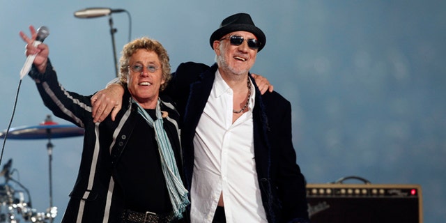 The Who guitarist Pete Townshend (r., with bandmate Roger Daltrey) says he downloaded child porn in a bid to follow the money trail. (AP)