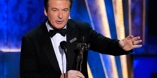 Actor Alec Baldwin accepts the award for outstanding performance by a male actor in a comedy series for "30 Rock" at the 18th annual Screen Actors Guild Awards in Los Angeles, Calif. on Jan. 29, 2012.