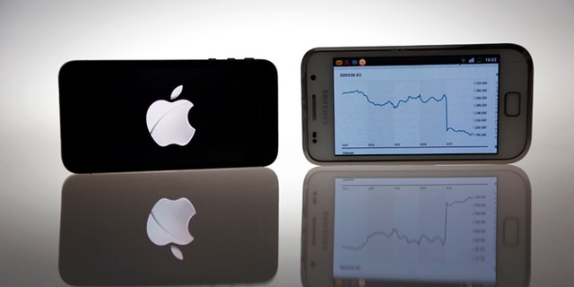 Aug. 27, 2012: An Apple IPhone 4s and Samsung Galaxy S are seen in this illustration photo in Berlin.