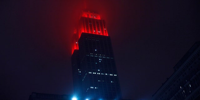 The Empire State Building is lit up in red in honor of World AIDS Day in New York December 1, 2012. (REUTERS/Eduardo Munoz)