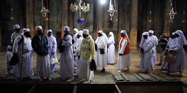Nigerian pilgrims visit the Church of Nativity, the site revered by Christians as Jesus' birthplace, in the West Bank town of Bethlehem, Dec. 24, 2012.