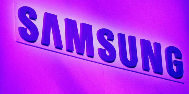 The company logo is displayed at the Samsung news conference at the Consumer Electronics Show (CES) in Las Vegas January 7, 2013.