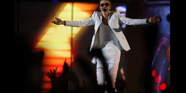 Feb. 21, 2013: Canadian singer Justin Bieber performs in a concert at the Manchester Arena in Manchester, northern England.