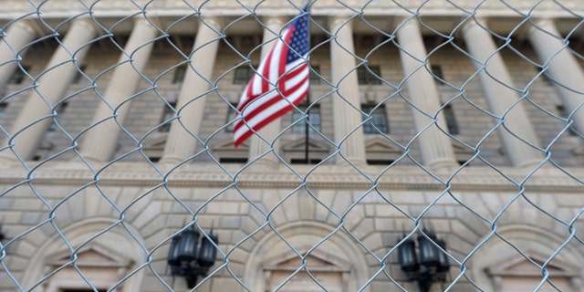 A fence surrounds the U.S. Department of Commerce in Washington October 5, 2013.