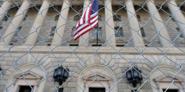 A fence surrounds the U.S. Department of Commerce in Washington October 5, 2013.