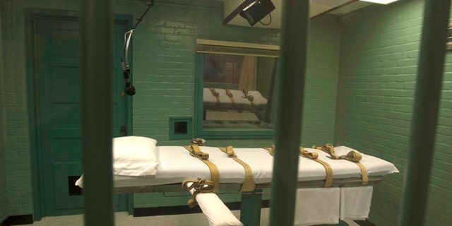 Sept. 29, 2010: The death chamber is seen through the steel bars from the viewing room at the state penitentiary in Huntsville, Texas.