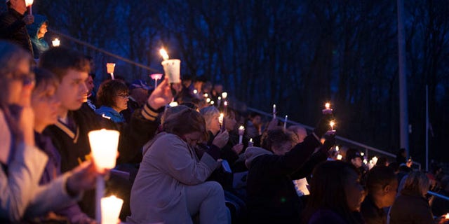 April 28, 2014: People gather at Jonathan Law High School during a vigil for slain student Maren Sanchez in Milford, Connecticut.