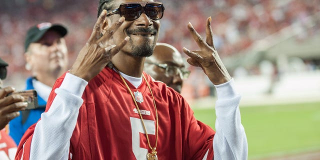 Music artist Snoop Dogg reacts to the crowd after performing during the halftime show at Levi's Stadium. (Ed Szczepanski-USA TODAY Sports)