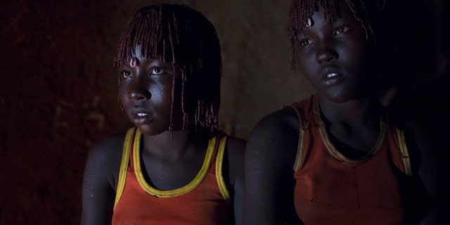 Oct. 16, 2014: Pokot girls wait together in a home before their circumcision ceremony in a village in Kenya.