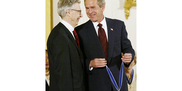 U.S. President George W. Bush laughs alongside Fred Rogers during the presentation of the Presidential Medal of Freedom ceremony, America's highest civilian award, at the White House, July 9, 2002. The medal is awarded to those deemed to have made especially meritorious contributions to the security or national interests of the United States, to world peace, or to cultural or other significant public or private endeavors.