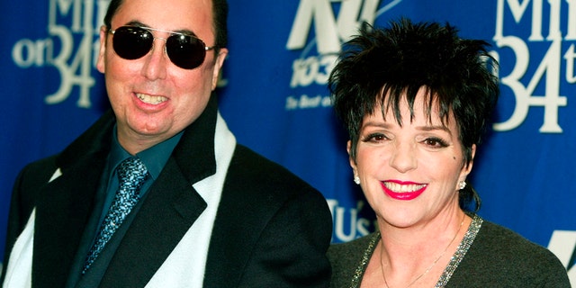 Singer Liza Minnelli and her husband David Gest pose for photographers backstage of the "Miracle on 34th Street" concert hosted by radio station WKTU in New York City, December 18, 2002.