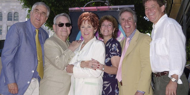 Actress Marion Ross (third, left), who portrayed the matriarch on the television comedy series "Happy Days," poses with the show's creator Garry Marshall (L) and cast members Tom Bosley. Erin Moran, Henry Winkler and Anson Williams following a ceremony honoring her with the 2,182nd star on the Hollywood Walk of Fame July 12, 2001 in Los Angeles.