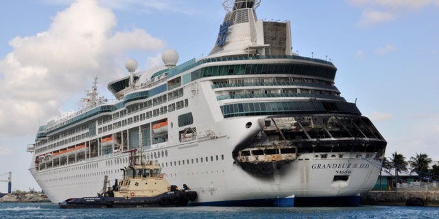Damage on the Royal Caribbean ship Grandeur of the Seas is pictured as the ship is docked in Freeport May 27, 2013. A fire broke out on the ship's aft mooring deck in the early hours of Monday morning. The fire was extinguished at 0458 ET, and all 2,224 passengers and 796 crew members were safe and accounted for, according to the company. REUTERS/Vandyke Hepburn (BAHAMAS - Tags: MARITIME DISASTER BUSINESS TPX IMAGES OF THE DAY) - RTX103FM