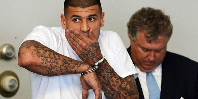 New England Patriots tight end Aaron Hernandez is arraigned on charges of murder and weapons violations in Attleborough, Massachusetts, after being arrested, June 26, 2013. Hernandez, a 23-year-old rising football star with the New England Patriots, was arrested by police in a murder investigation and fired by the team on Wednesday, another blot on the National Football League's tightly protected image.