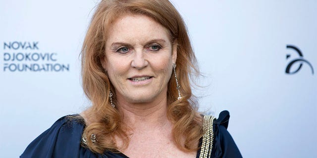 Britain's Sarah Ferguson, the Duchess of York, poses for photographers as she arrives at a fundraising dinner for the Novak Djokovic Foundation in London July 8, 2013. REUTERS/Neil Hall (BRITAIN - Tags: SPORT TENNIS ENTERTAINMENT SOCIETY PROFILE HEADSHOT ROYALS) - GM1E9790CWB01