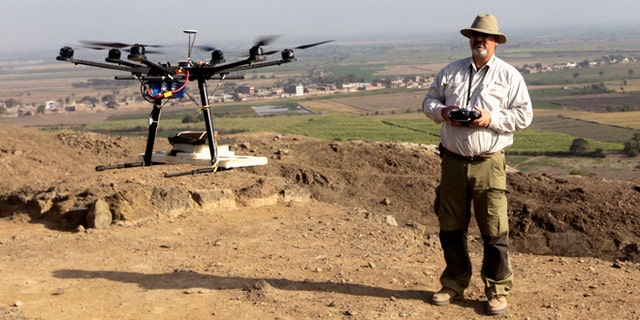 Luis Jaime Castillo, a Peruvian archaeologist with Lima's Catholic University and an incoming deputy culture minister, flies a drone over the archaeological site of Cerro Chepen in Trujillo August 3, 2013.