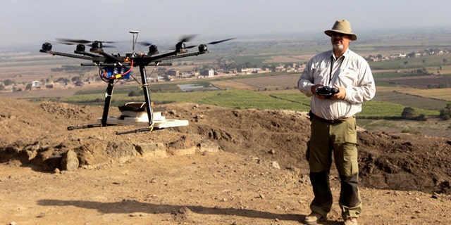 Luis Jaime Castillo, a Peruvian archaeologist with Lima's Catholic University and an incoming deputy culture minister, flies a drone over the archaeological site of Cerro Chepen in Trujillo August 3, 2013.