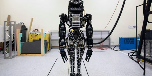 Bipedal humanoid robot "Atlas", primarily developed by the American robotics company Boston Dynamics, is presented to the media during a news conference at the University of Hong Kong October 17, 2013. Google recently acquired the company.