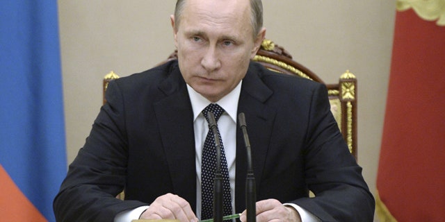 Dec. 4,2015: Russian President Vladimir Putin chairs a meeting with members of the Security Council at the Kremlin in Moscow, Russia.
