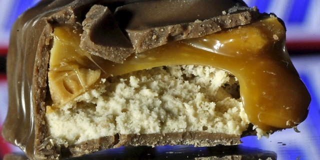 Snickers bars are seen in this picture illustration taken February 23, 2016. Mars Inc has recalled chocolate bars and other products in 55 countries, mainly in Europe, after bits of plastic were found in a Snickers bar in Germany, the U.S. chocolate maker said on Tuesday. All of the recalled products, which include Mars, Snickers and Milky Way bars, were manufactured at a Dutch factory in Veghel, according to a Mars spokeswoman. The recall follows a Jan. 8 complaint from a consumer in Germany, she said, who found red plastic in a Snickers bar and sent it back to the company. REUTERS/Dado Ruvic/Illustration - RTX288C3