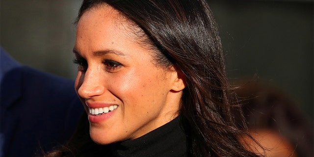 Meghan Markle leaves after visiting a school with her fiancee Britain's Prince Harry in Nottingham, December 1, 2017.