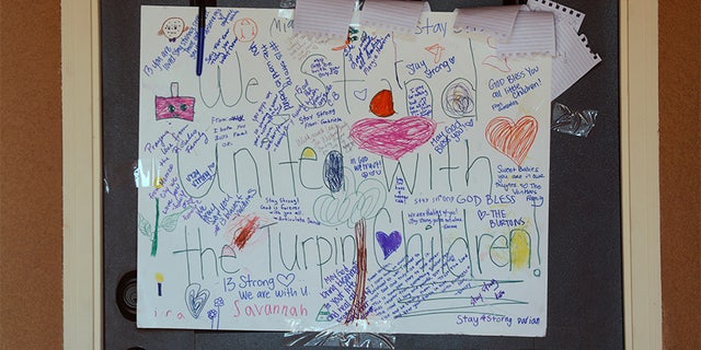 A sign showing support for the Turpin children is seen on the front door of the home of David Allen and Louise Anna Turpin in Perris, California, U.S.,January 24, 2018.