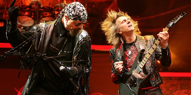 Singer Rob Halford (L) and guitarist Glenn Tipton of British metal band Judas Priest perform on stage at Globen Arena in Stockholm February 28, 2009.