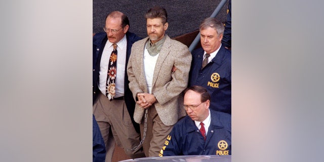 Unabomber suspect Ted Kaczynski is taken from the Helena federal courthouse by U.S. Marshals April 19. A federal judge denied Kaczynski's motion to dismiss the charges against him - RTXGTZC