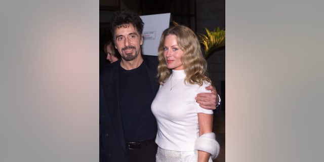 In this 1999 photo, actor Al Pacino, (L) star of the new film "The Insider", poses with girlfriend Beverly D'Angelo at the film's premiere in Beverly Hills.
